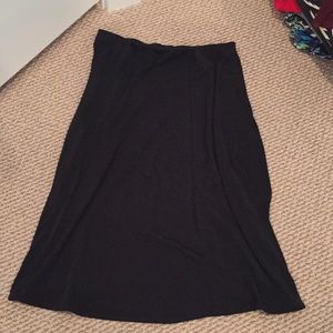 Midi length flowy black skirt.